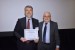 Dr. Nagib Callaos, General Chair, giving Dr. Nicola Fabiano the best paper award certificate of the session "Informatics and Cybernetics." The title of the awarded paper is "Ethics and the Protection of Personal Data."
